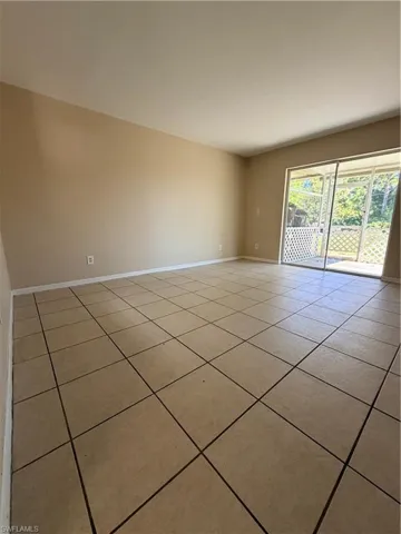 Unfurnished room featuring light tile patterned floors