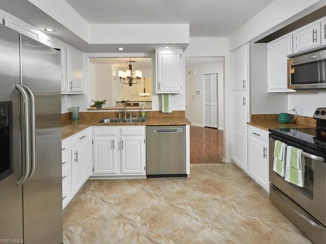 Kitchen is open to the dining area and offers plenty of storage.