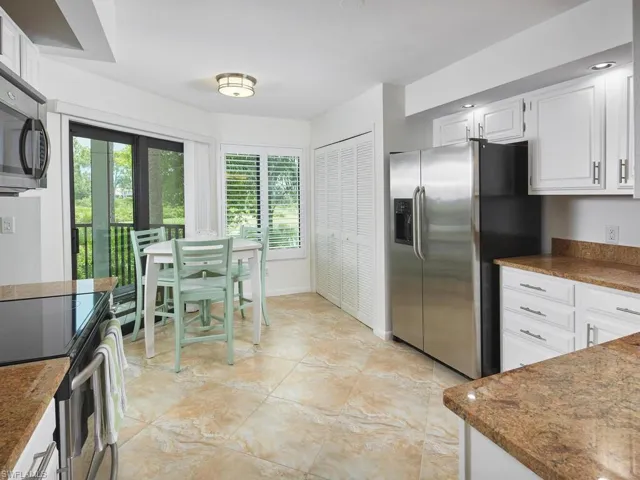 Charming and spacious eat in kitchen, overlooking the golf course.