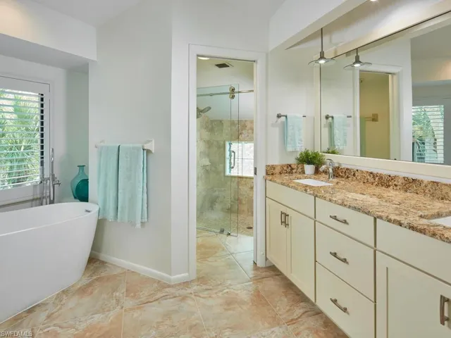 Spacious primary bathroom with a soaking tub to enjoy after a day on the golf course!