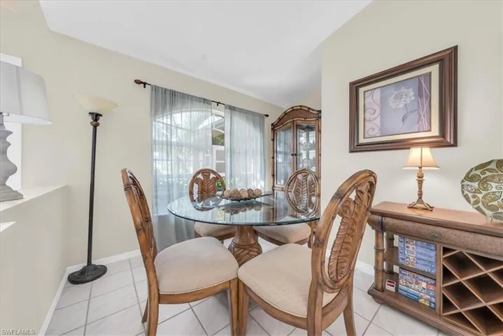 Dining space featuring light tile patterned floors