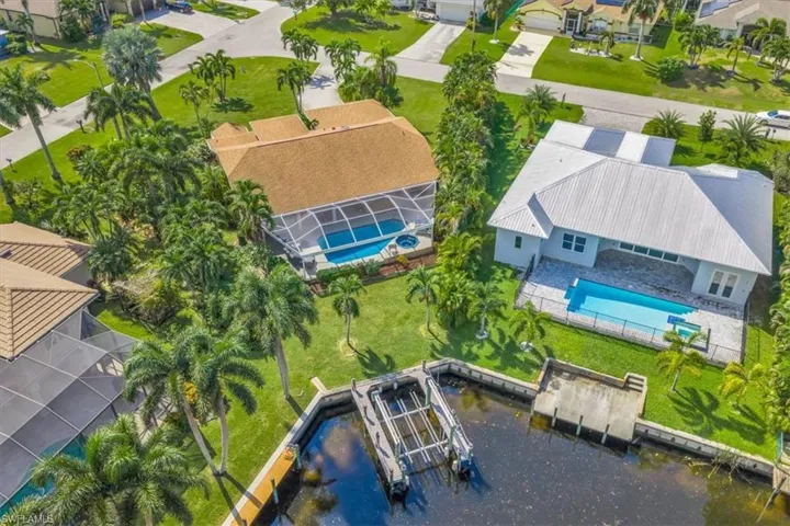 Aerial perspective of suburban area with a pool