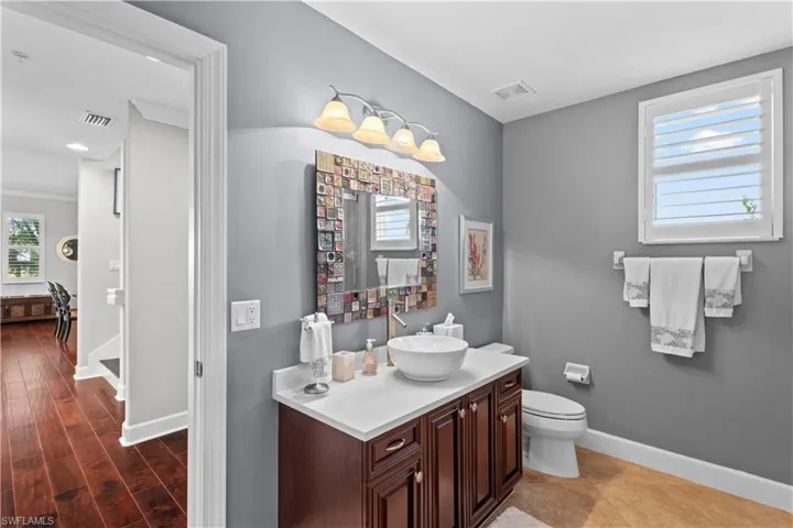 Bathroom with vanity and baseboards