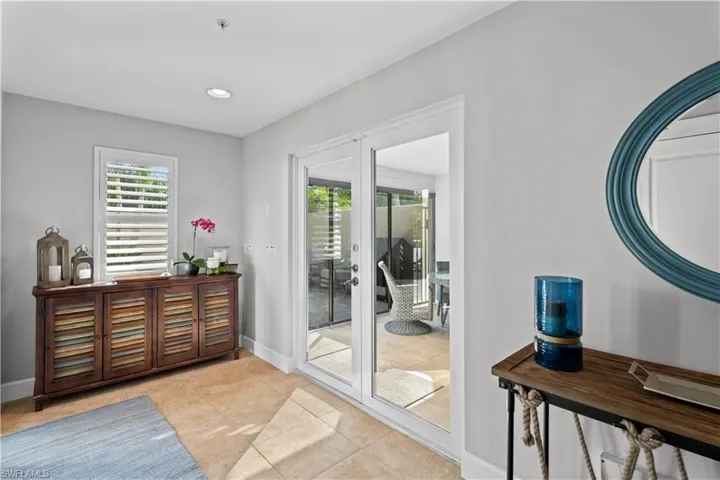 Doorway to outside featuring plenty of natural light, recessed lighting, and tile patterned floors