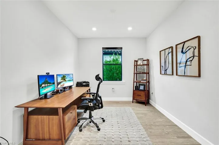 Den/Flex Room with light tile flooring and recessed lighting