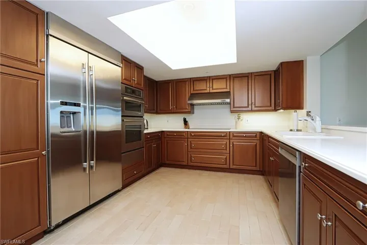 Kitchen featuring sink, light hardwood / wood-style flooring, and stainless steel appliances
