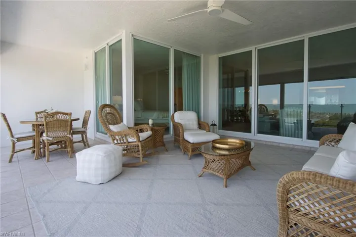 View of terrace featuring an outdoor hangout area and ceiling fan