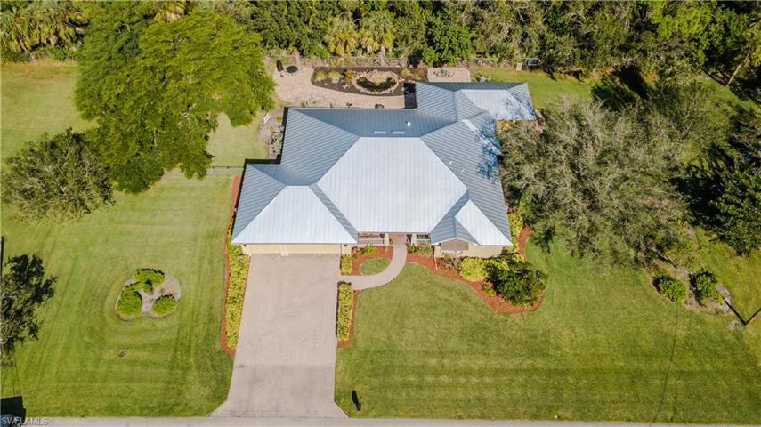 Large lot (.52 acre) with private wooded area in back and community park across the street