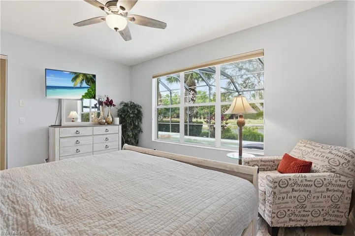 Bedroom with a ceiling fan and wood finished floors