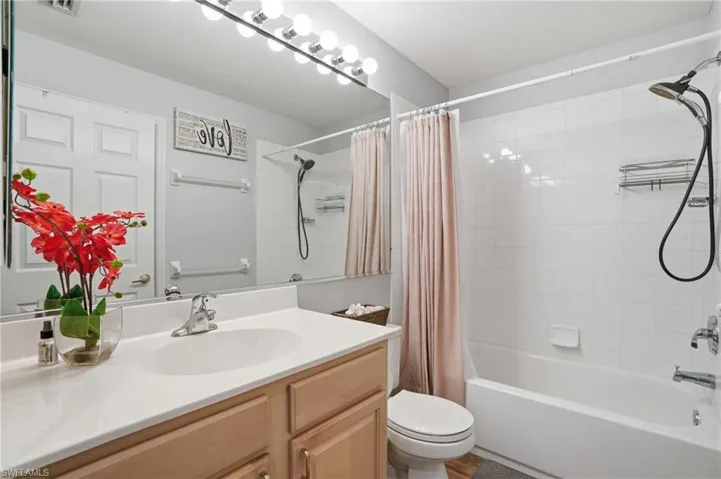 Full bathroom with vanity and shower / tub combo