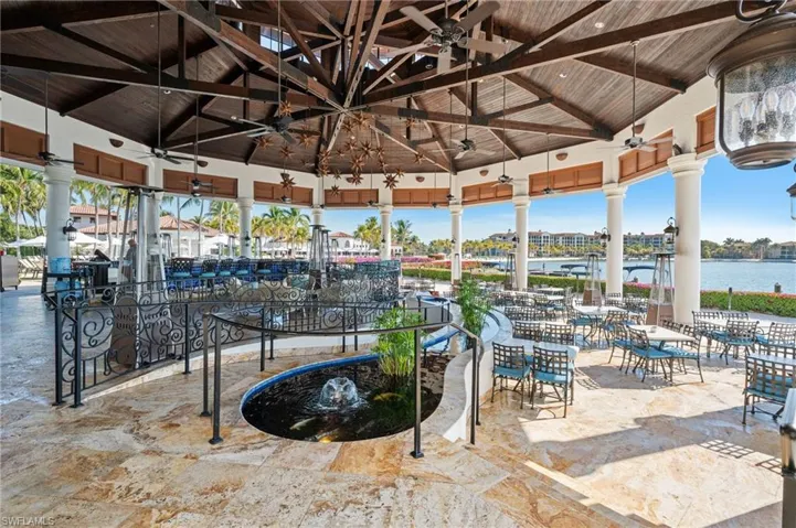 View of patio featuring outdoor dining space and a water view