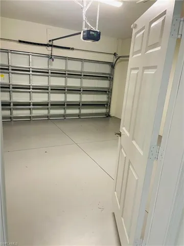 Garage featuring a garage door opener
