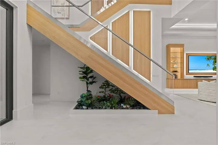 Stairway featuring baseboards and recessed lighting