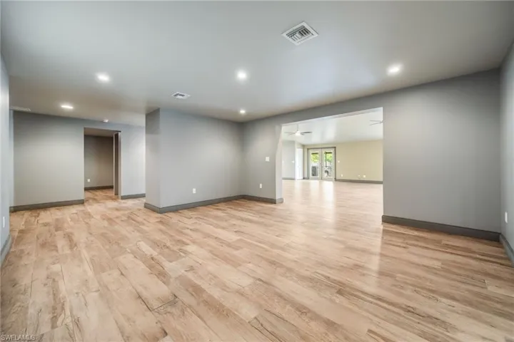Empty room with light wood-style flooring, recessed lighting, and ceiling fan