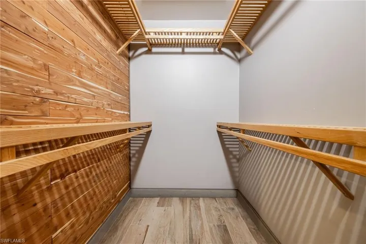 Spacious closet featuring light wood-style floors