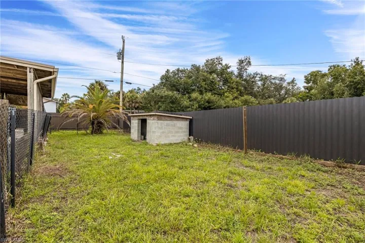 View of fenced backyard