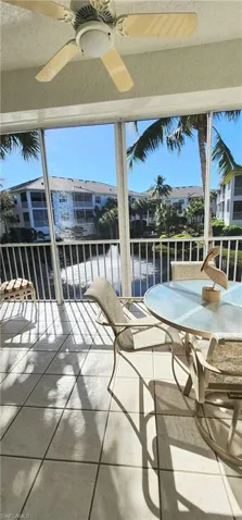 sunny southern exposure furnishings include table 4 chairs, and a cushioned chase with ottoman, small side table.