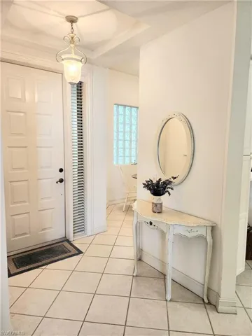 virtually staged huge master bedroom with sunny window views of lake