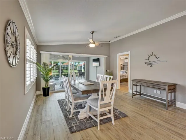 Wide vinyl plank flooring throughout and neutral colors.