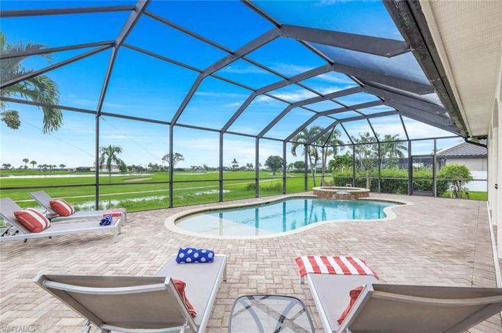 Beautiful view of the 18th Fairway from the Large Screened Pool Lanai