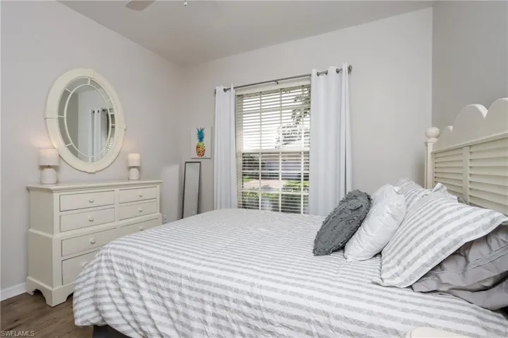 Bedroom featuring dark wood finished floors and ceiling fan