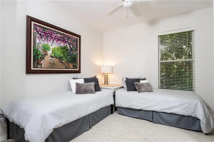 Bedroom with carpet and ceiling fan