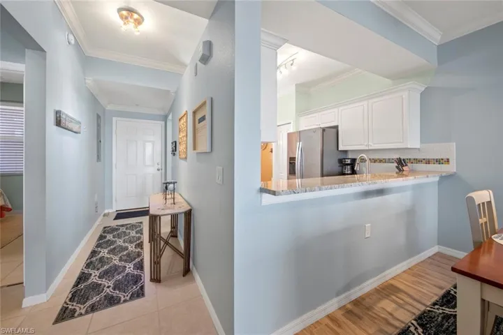 Breakfast bar to right, entry hall to from door on left
