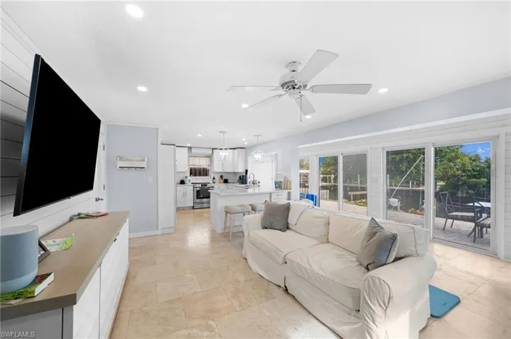 Living room featuring ceiling fan