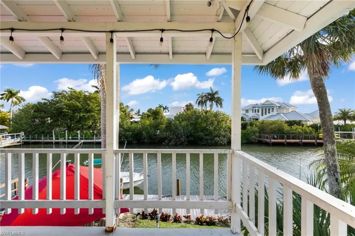Wooden terrace featuring a water view