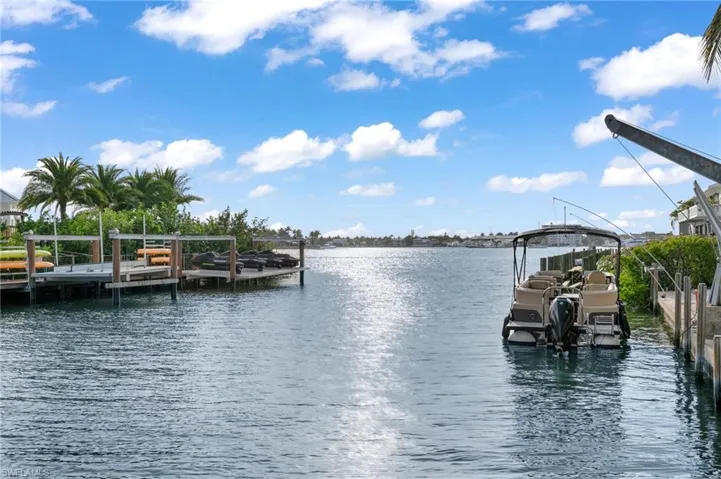 Dock area featuring a water view