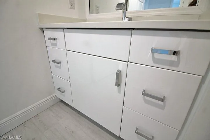 Custom high gloss cabinets in the bathrooms.
