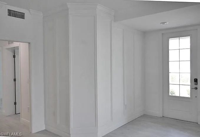 Entryway w/wood accent walls.
