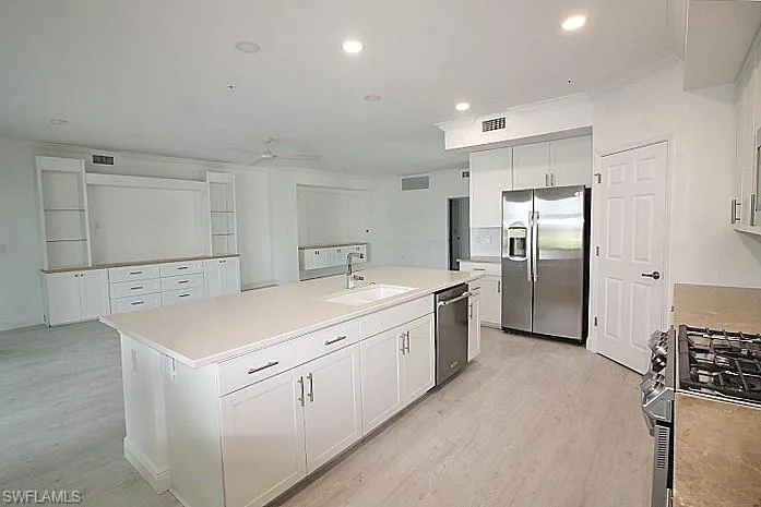 You'll never feel alone in the kitchen again. Great floor plan for entertaining or family dinners.