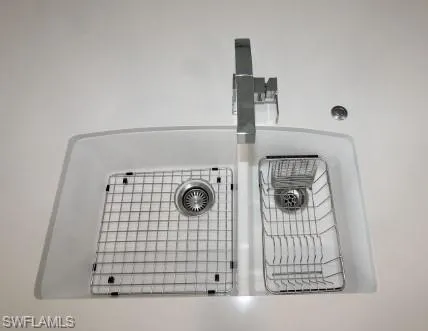 Custom sink with accessories set into the custom Quartz countertop.