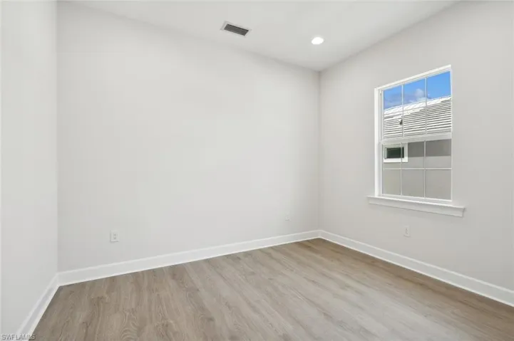 Spare room with light wood-type flooring