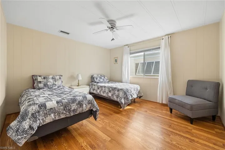 Bedroom featuring wood finished floors and ceiling fan