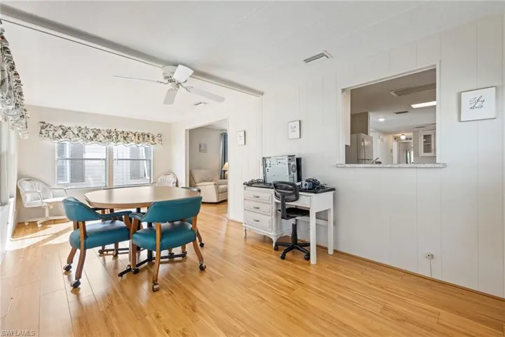 Dining room featuring light wood-type flooring and ceiling fan