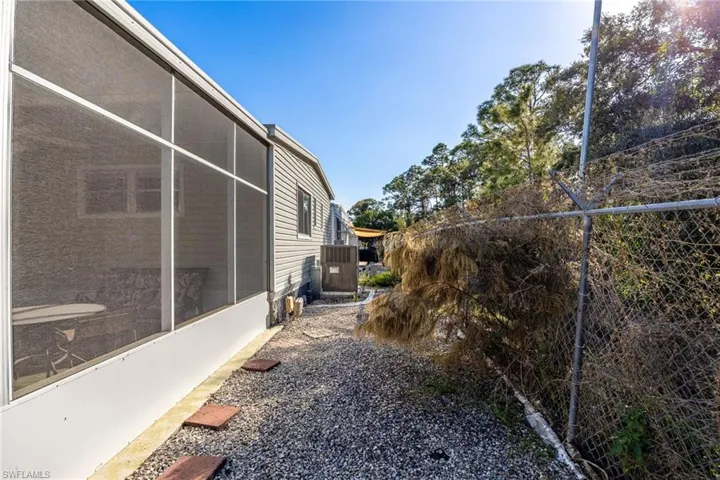 View of yard featuring a sunroom