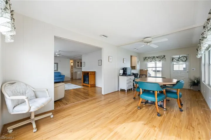 Dining area featuring light wood-style flooring and ceiling fan