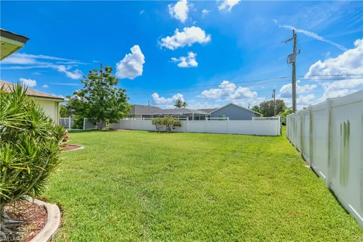 View of fenced backyard