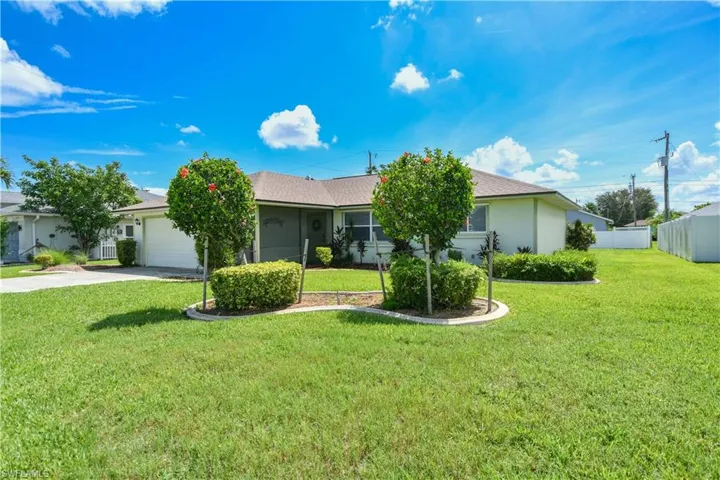 Single story home with an attached garage and concrete driveway