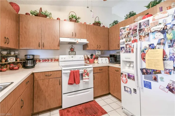 Kitchen featuring white appliances