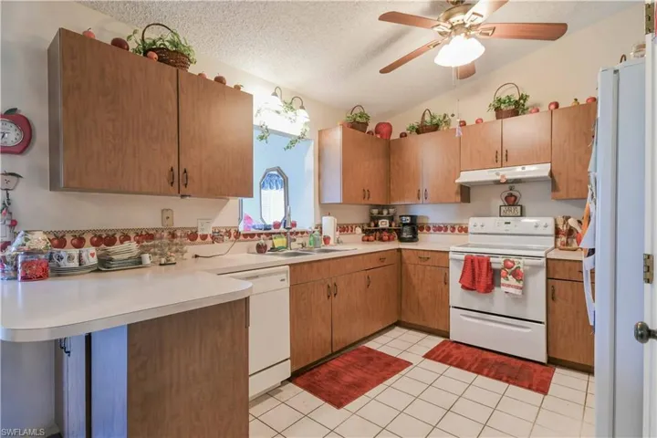 Kitchen featuring white appliances