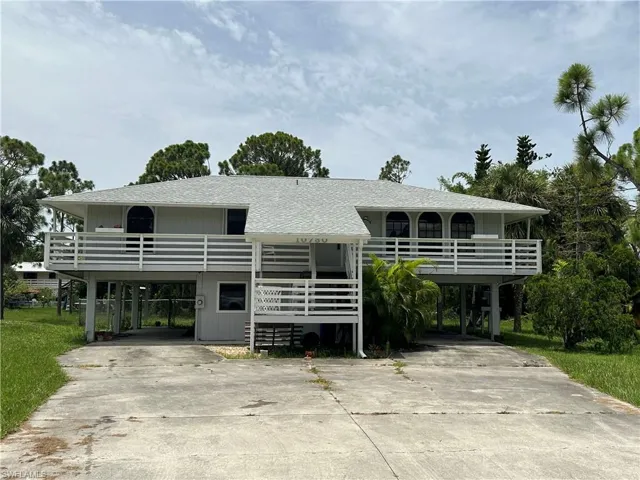 Raised beach house with a carport