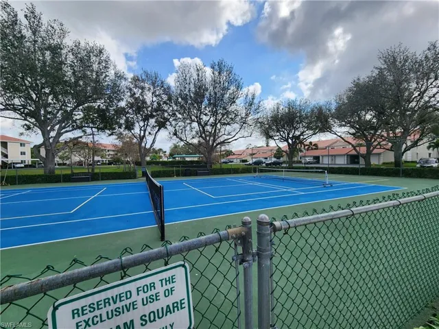 View of tennis court featuring community basketball court
