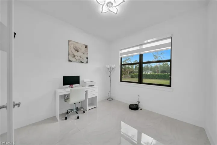 Office area featuring baseboards