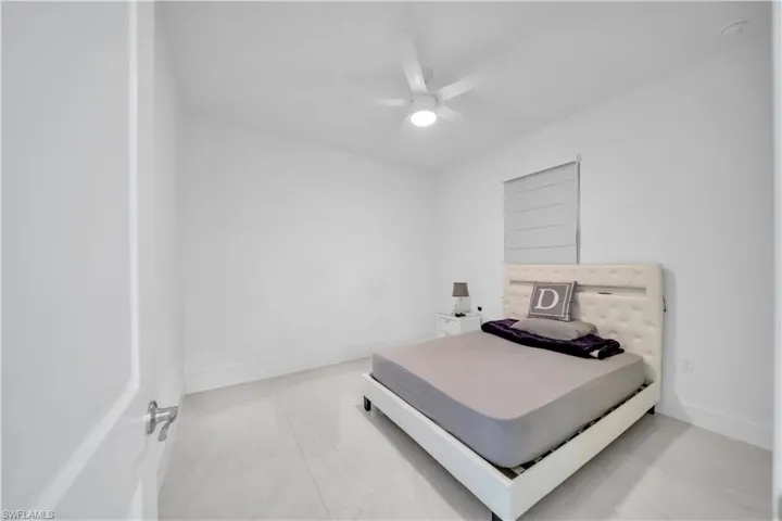Bedroom with baseboards and a ceiling fan