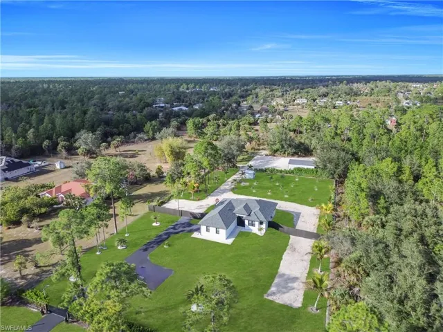 Aerial overview of property's location featuring a forest