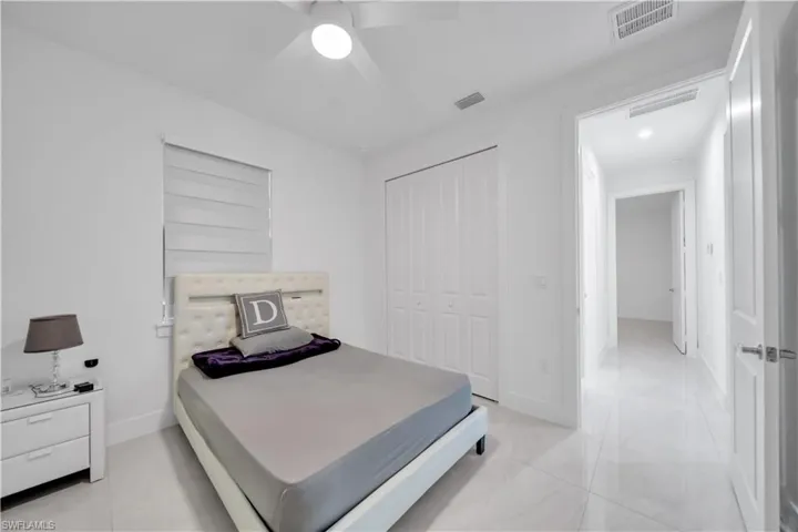 Bedroom featuring a ceiling fan, a closet, and recessed lighting