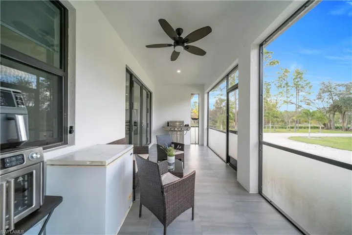 Sunroom / solarium with ceiling fan, recessed lighting, and area for grilling